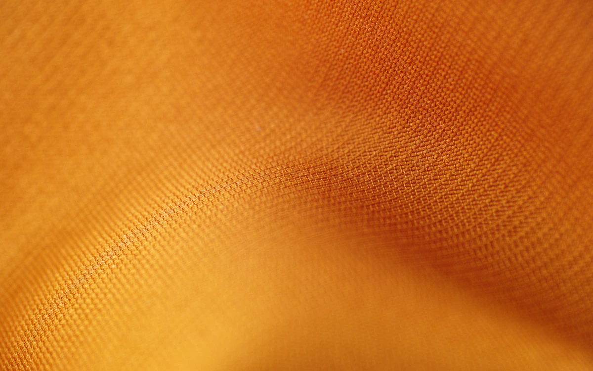 Orangefarbenes, grob gewebtes Canvas-Gewebe.